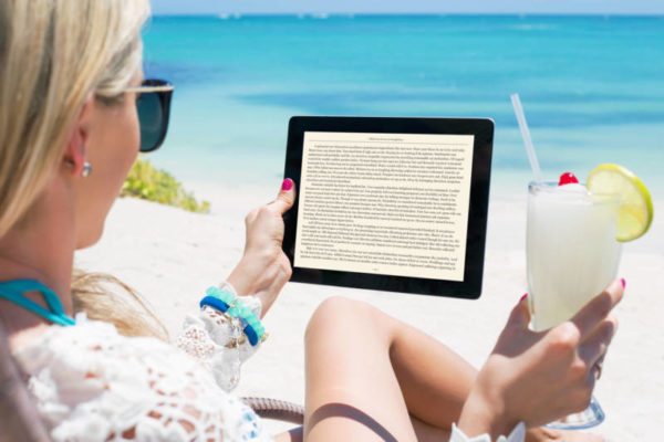 Woman reading ebook on digital tablet